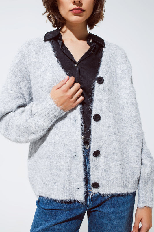 Cardigan gris à col en V profond avec détails en dentelle